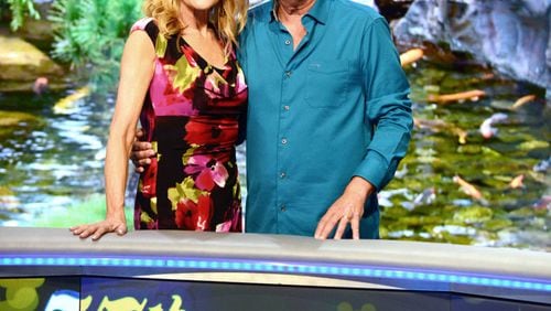 'Wheel of Fortune' hosts Vanna White, left, and Pat Sajak attend a taping of the show's 35th Anniversary Season at Epcot Center at Walt Disney World in Orlando, Florida.