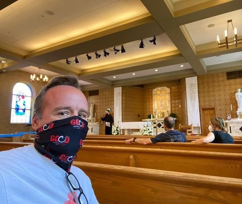 Chris Harvey, a parishioner of St. Thomas More Catholic Church in Decatur, when he was in training to be an usher during the pandemic. As he put it, “It’s non-negotiable here. No mask? No Jesus for you!” (Photo courtesy of Chris Harvey)