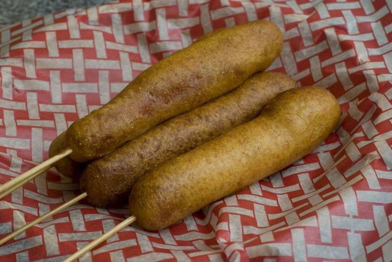 Corn dogs are a staple of concession stands at county fairs. (Associated Press)