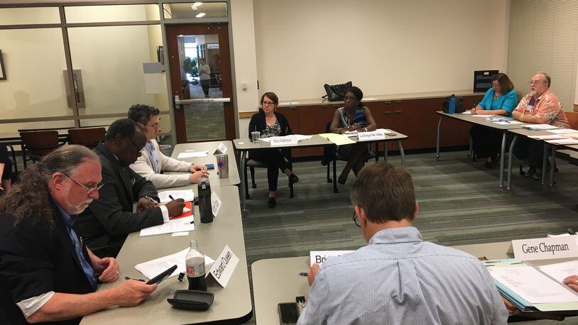 The DeKalb County Board of Ethics held a meeting at the Emory University Center for Ethics on April 20, 2017. From left: DeKalb Board of Ethics members Ed Queen, Robert Tatum, Dan DeWoskin, Ethics Officer Stacey Kalberman, Deputy Ethics Officer Latonya Nix Wiley, board member Brian Deutsch, Administrative Assistant Suzanne Amato and county resident Stephen Binney. MARK NIESSE / MARK.NIESSE@AJC.COM