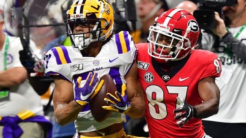 LSU's Derek Stingley Jr. intercepts a pass intended for Georgia's Tyler Simmons. Stingley is expected to be selected in the first round of the upcoming NFL draft. (Hyosub Shin / hyosub.shin@ajc.com)