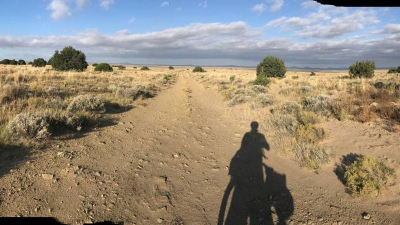 Mark Finley of Spokane departs a campsite 30 miles north of Pietown, New Mexico, as he rides a segment of the 2,750-mile Great Divide Mountain Bike Route.(PHOTO COURTESY OF MARK FINLEY)