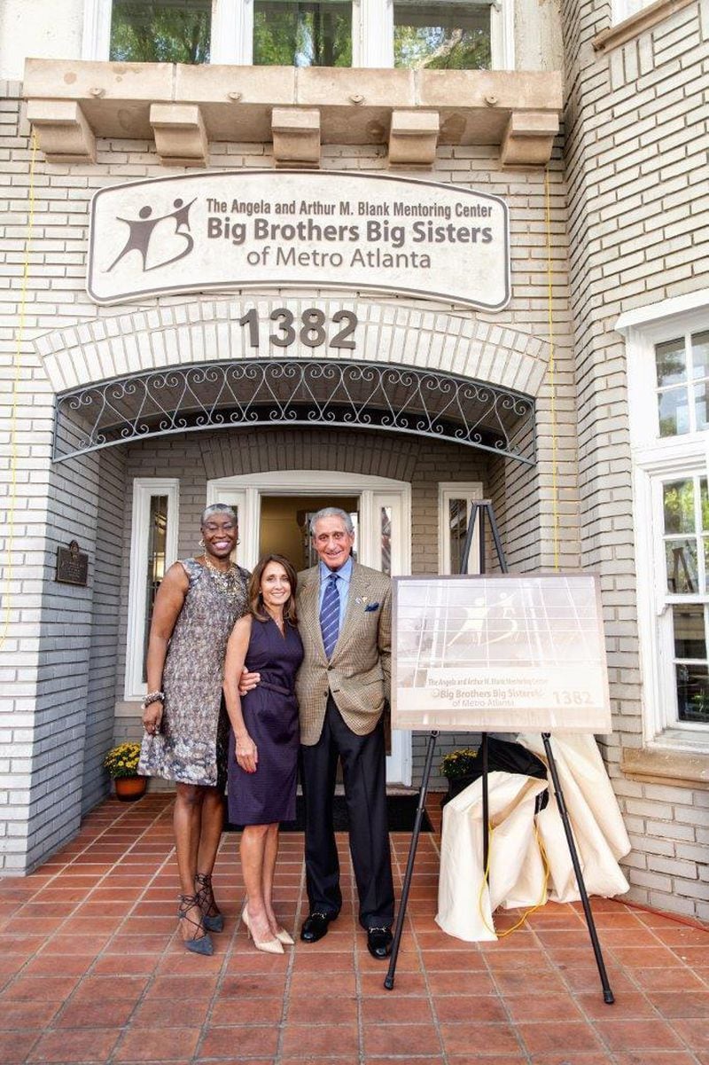 Janice McKenzie-Crayton poses with Angela and Arthur Blank during the successful completion of a fund drive that allowed her organization to buy a new facility in Midtown Atlanta. Photo: courtesy Big Brothers Big Sisters of Metro Atlanta