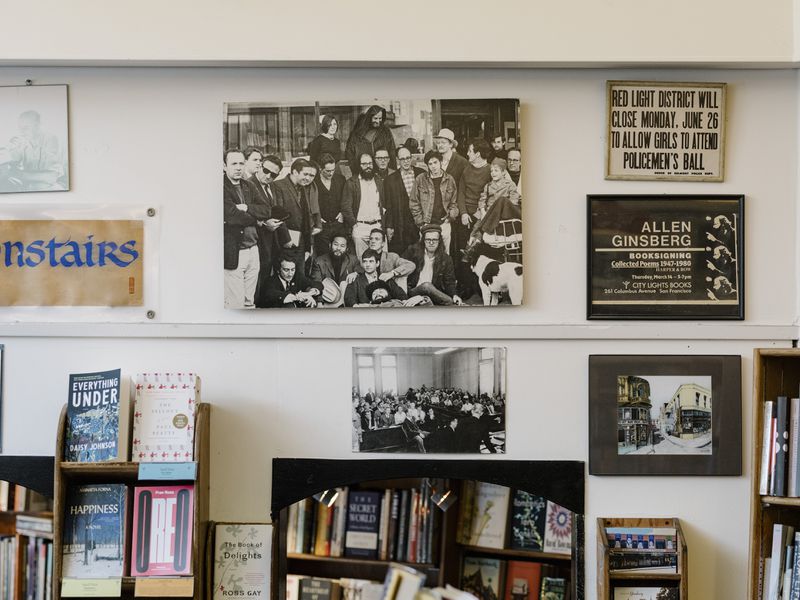 Photos of the Beat movement writers on the wall at the City Lights bookstore in San Francisco. (Jason Henry/The New York Times)