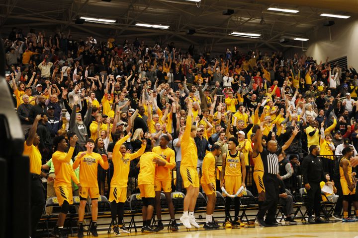Kennesaw State's bench players and fans jumped from their seats after their team took the lead in the last minutes of the game.
 Miguel Martinez / miguel.martinezjimenez@ajc.com