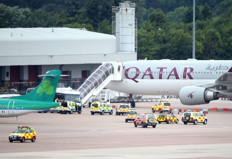A Qatar Airways flight from Doha sits on the tarmac at the Manchester Airport, in Manchester, England.