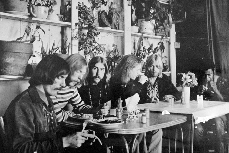 This undated photo shows members of the Allman Brothers Band, from left, Dickey Betts, Duane Allman, Berry Oakley, Butch Trucks, Gregg Allman and Jai Johanny "Jaimoe" Johanson, eating at the H&H Restaurant in downtown Macon. (The Macon Telegraph via AP, File)