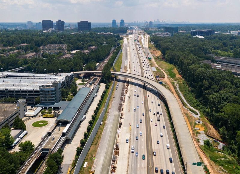 July 22, 2021 Sandy Springs - Aerial photo shows Ga. 400 (L-Northbound, R-Southbound), where toll lanes could be built on Thursday, July 22, 2021. North Springs MARTA station is shown on left. S. (Hyosub Shin / Hyosub.Shin@ajc.com)