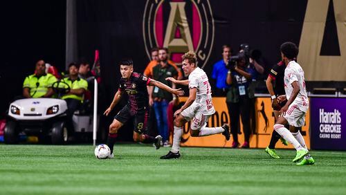 Atlanta United midfielder Thiago Almada #8 dribbles the ball during the match against New York Red Bulls at Mercedes-Benz Stadium in Atlanta, United States on Wednesday August 17, 2022. (Photo by Kyle Hess/Atlanta United)