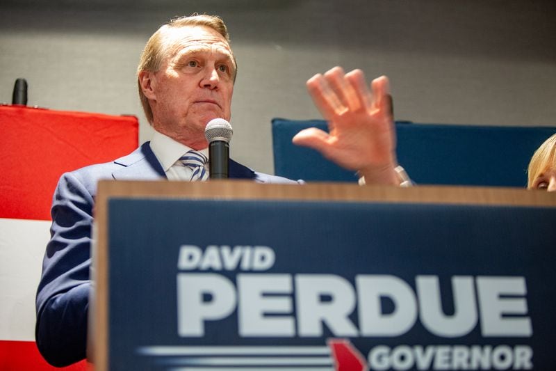 Former Republican U.S. Sen. David Perdue has shut down his $4.3 million federal campaign account. He took $3 million of it to repay loans he made to his campaigns. Much of the remainder was given to political groups, including $100,000 to Gov. Brian Kemp's leadership committee to support his reelection. The move could heal wounds between the two after Perdue waged a challenge to Kemp's reelection in the GOP primary. (Jenni Girtman for The Atlanta Journal-Constitution)