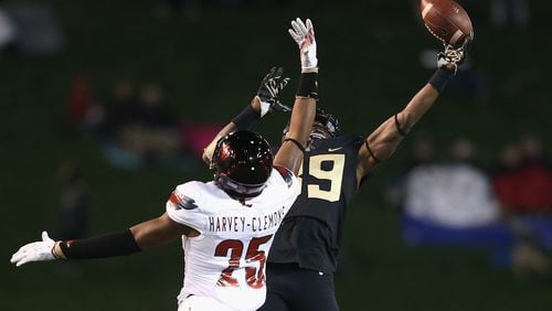 Former Georgia Bulldog Josh Harvey-Clemons of Louisville breaks up a pass to Chuck Wade of Wake Forest during their game at BB&T Field on October 30, 2015 in Winston Salem, North Carolina. (Photo by Streeter Lecka/Getty Images)