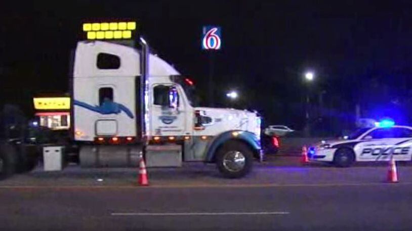 The semitruck was turning left onto I-85 when it hit the motorcycle, according to South Fulton police.