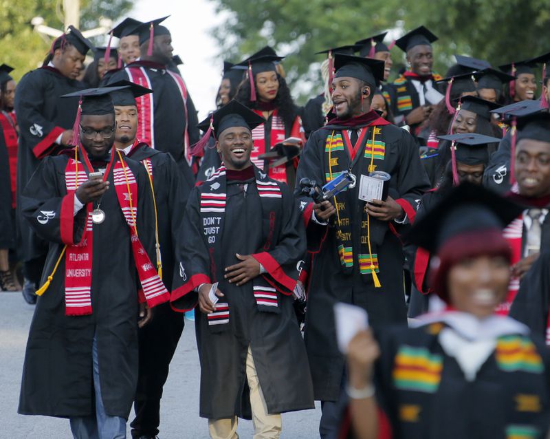 5/22/17 - Atlanta - Graduates walk from the student center to the stadium for graduation.  Clark Atlanta University's Panther Stadium was the site of their 28th annual Commencement.  Businessman William Pickard gave the commencement address.   Rev. Jesse Jackson, who received an honorary degree, also spoke.   Panther Stadium,  BOB ANDRES  /BANDRES@AJC.COM
