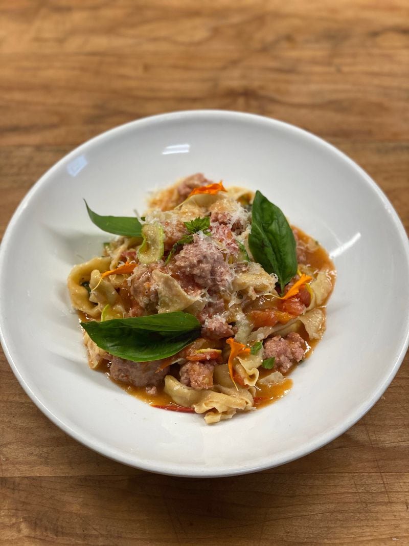 Tagliatelle with fresh tomatoes, sausage, basil and Parmesan from Deer and the Dove.