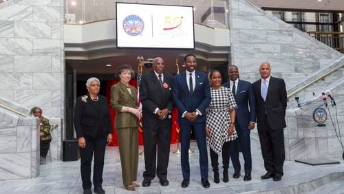 Atlanta Mayor Andre Dickens, center, stands with former Atlanta Mayors Shirley Franklin, left, Keisha Lance Bottoms, third from right, Kasim Reed, second from right, Bill Campbell, right, Valerie Jackson, second from left, and Rev. Gerald Durley during the celebration commemorating the 50th anniversary of the inauguration of Mayor Maynard Jackson at the Atlanta City Hall Atrium, Monday, January 8, 2024, in Atlanta. Valerie Jackson is the widow of Maynard Jackson. (Jason Getz / Jason.Getz@ajc.com)