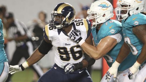 MIAMI GARDENS, FL - AUGUST 28: Defensive end Michael Sam #96 of the St. Louis Rams tries to elude Nate Garner #75 of the Miami Dolphins in the second quarter at Sun Life Stadium on August 28, 2014 in Miami Gardens, Florida. (Photo by Marc Serota/Getty Images) Michael Sam had three sacks in preseason but no team has signed him to its practice squad. (AP photo)