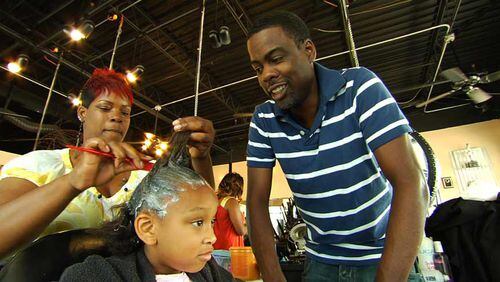 Chris Rock, checking out a stylist at work, brings a silly-serious approach to "Good Hair."