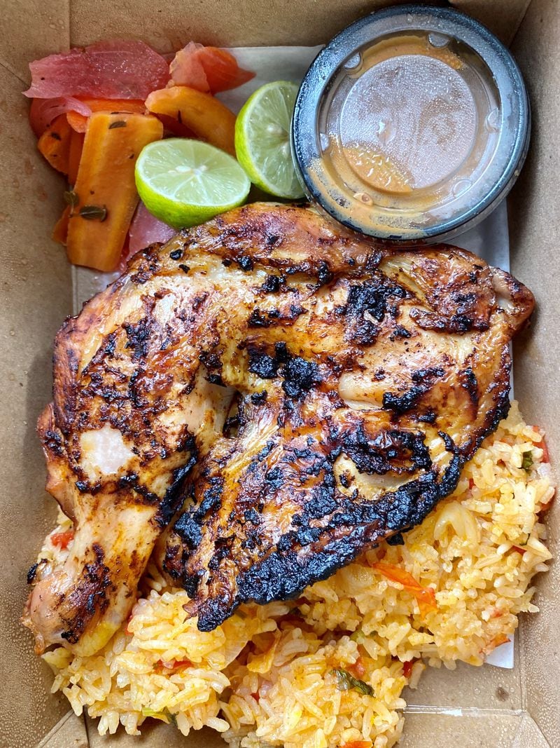 This takeout order from Gato includes: an adobo chicken quarter with seca soup rice, escabeche, salsa macha and key lime. Wendell Brock for The Atlanta Journal-Constitution