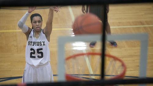 February 21, 2014 Atlanta- St. Pius player Asia Durr (25) takes a shot from the free-throw line during a High School basketball game on Friday, Feb. 21, 2014, in Atlanta, Ga. St. Pius defeated North Oconee 52-49 in the first round of the high school state tournament. BRANDEN CAMP/SPECIAL St. Pius player Asia Durr (25) takes a shot from the free-throw line. (Branden Camp / Special to AJC)