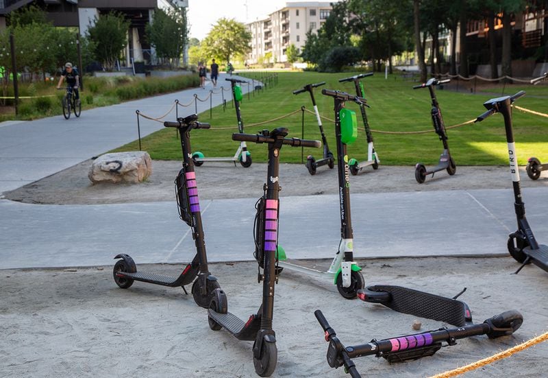 Multiple e-scooters parked at the Beltine entrance to Ponce City Market in Atlanta on Thursday August 22nd, 2019. He shares his thoughts on e-scooters. The Beltline started out prohibiting motorized vehicles. In January, the Atlanta City Council passed a law allowing for e-scooters to be used on the trails. Does this compromise the Beltline's purpose?  (Photo by Phil Skinner)