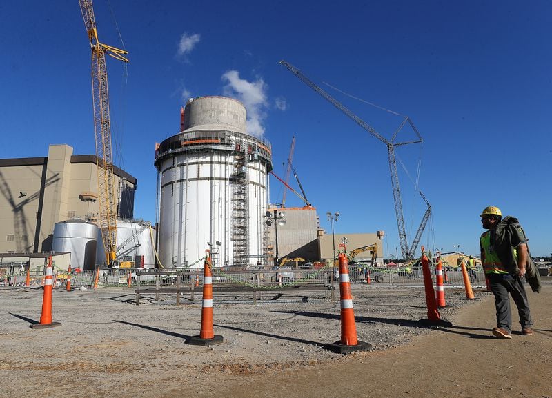 A construction worker takes in the view of exterior work on Unit 4 at Plant Vogtle on Tuesday, Dec 14, 2021, in Waynesboro.  “Curtis Compton / Curtis.Compton@ajc.com”`