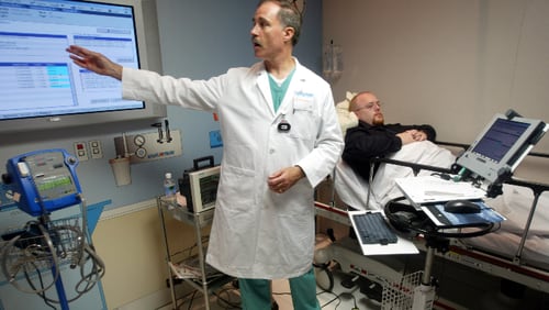 A physician consultant in Hollywood, Florida, gives a preview of a hi-tech system that will allow doctors and nurses to access patient information on wireless laptop computers at bedside.
