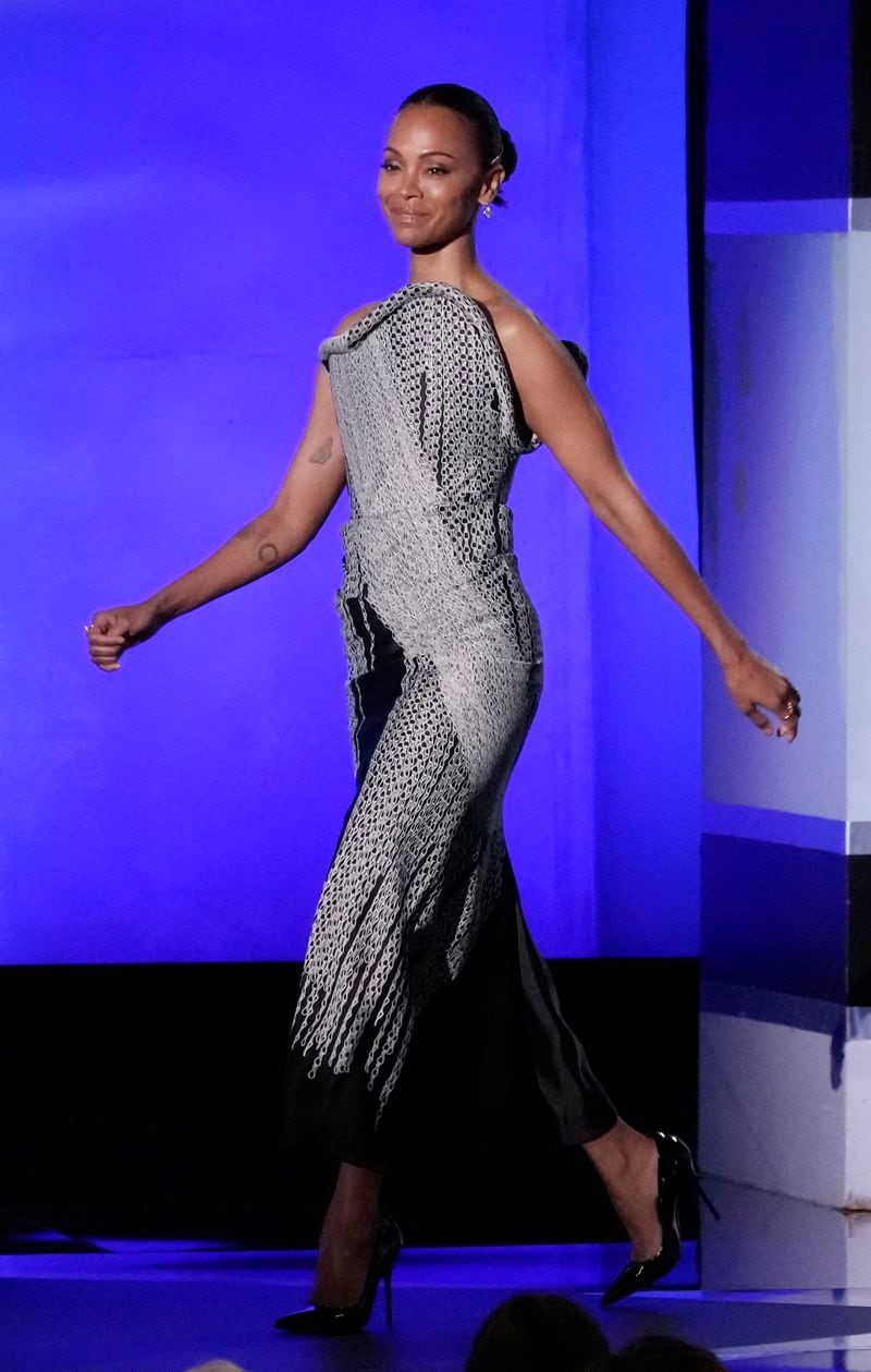 Actor Zoe Saldana walks onstage during the 49th AFI Life Achievement Award tribute to Nicole Kidman, Saturday, April 27, 2024, at the Dolby Theatre in Los Angeles. (AP Photo/Chris Pizzello)