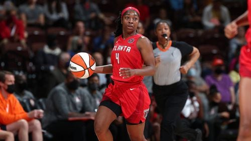 Aari McDonald of the Atlanta Dream handles the ball during the game against the Connecticut Sun on September 19, 2021 at the Mohegan Sun Arena in Uncasville, Connecticut.