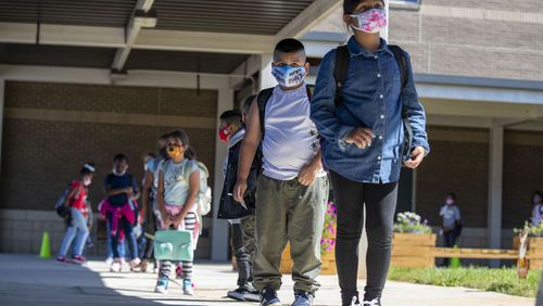 Cobb County Schools now allows students who were exposed to COVID in school to return to class if they are asymptomatic, rather than isolating for three days. (AJC file photo)