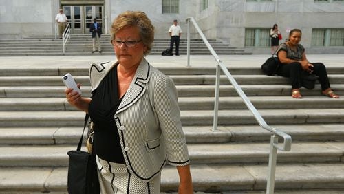 Former DeKalb County Commissioner Elaine Boyer made no comment as she left federal court after her arraignment hearing for bilking taxpayers out of thousands of dollars through a kickback scheme on Sept. 3, 2014. CURTIS COMPTON / CCOMPTON@AJC.COM