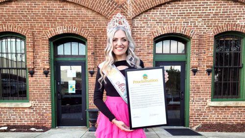 Kelly Sketo holds a framed copy of a proclamation she received from Hampton Mayor Ann Tarpley, and members of the City Council, on Sept. 12. Sketo was recognized for her community service and anti-bullying platform, which she will launch to schools throughout Henry County in October. (Handout)