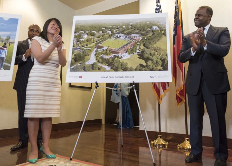 April 25, 2017 - Mayor Kasim Reed and Amy Phuong, Commissioner of Department of Parks and Recreation, left, applaud after revealing renderings of the Grant Park Gateway Project during a press conference. The Grant Park Gateway Project aims to alleviate traffic and address a lack of parking. 