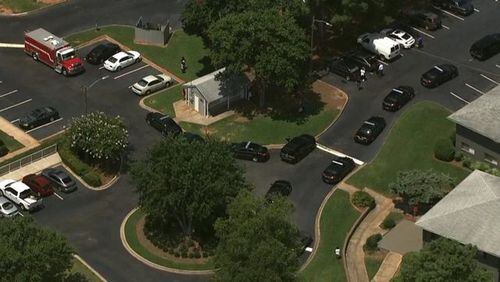 Police are investigating a deadly shooting outside an apartment in Cobb County. (Credit: Channel 2 Action News)