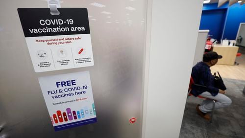A COVID-19 sign is seen inside the CVS at North Decatur on Wednesday, Sept. 13. 2023. The revised vaccines have been anticipated since last week's approval.  Miguel Martinez /miguel.martinezjimenez@ajc.com