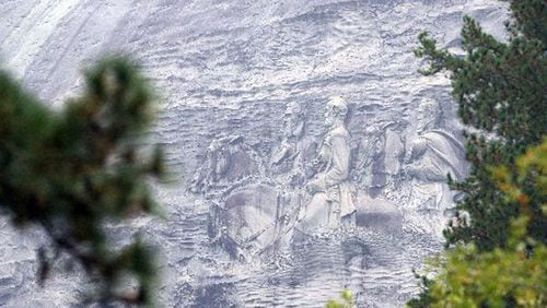 Stone Mountain, which is adorned with a huge carving depicting Confederate heroes, is classified as a Confederate memorial by state statute. KENT D. JOHNSON/AJC