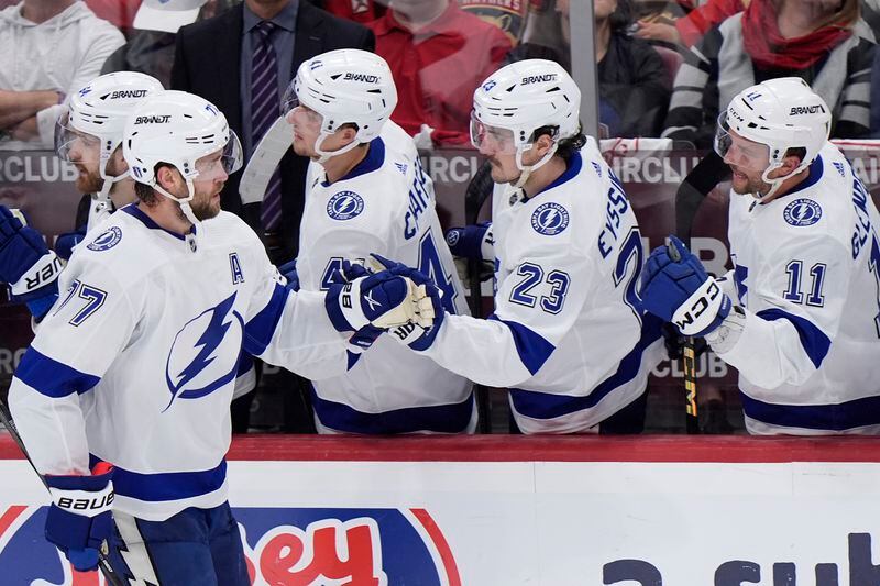 Tampa Bay Lightning defenseman Victor Hedman (77) is congratulated by teammates after he scored during the second period of Game 5 of the first-round of an NHL Stanley Cup Playoff series against the Florida Panthers, Monday, April 29, 2024, in Sunrise, Fla. (AP Photo/Wilfredo Lee)