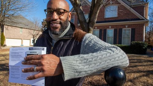 Cobb parent Kennall Mond was surprised to receive federal pandemic benefits in the mail for his two elementary students who usually would not qualify for the assistance. (Steve Schaefer for The Atlanta Journal-Constitution)