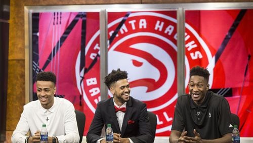 New Atlanta Hawks, John Collins (left), Tyler Dorsey (middle) and Alpha Kaba (right), sit together during a press conference to introduce the 2017 draft picks. Chad Rhym/ Chad.Rhym@ajc.com