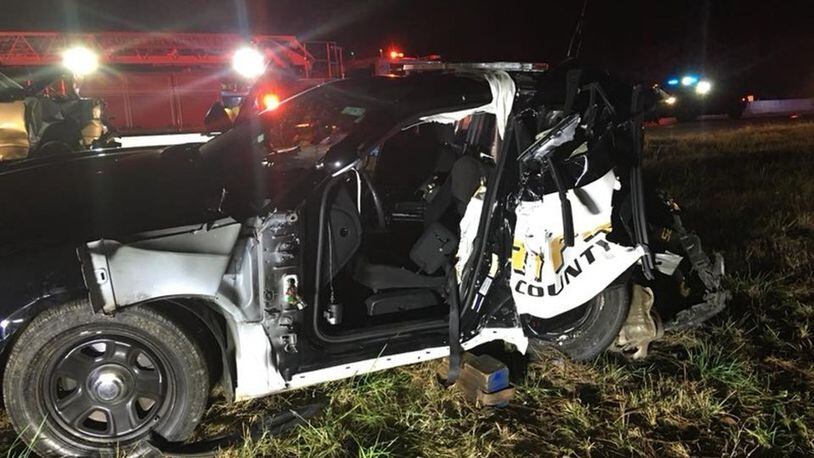 A Forsyth County Sheriff’s Office deputy was injured in 2017 when a vehicle driven by a motorist suspected of driving under the influence crashed into his parked patrol car on Ga. 400. (Photo: Forsyth County Sheriff’s Office)