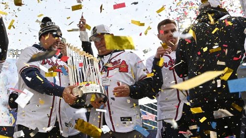 The Braves, led by manager Brian Snitker and first baseman Freddie Freeman, celebrate the one prize they all can share - the World Series Trophy - during a confetti-strewn affair at Truist Park. (Hyosub Shin / Hyosub.Shin@ajc.com)