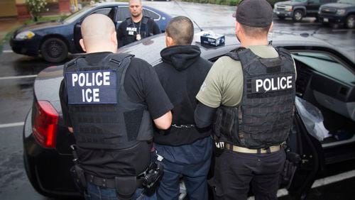 Feb. 7: U.S. Immigration and Customs Enforcement officers making an arrest  in Los Angeles.