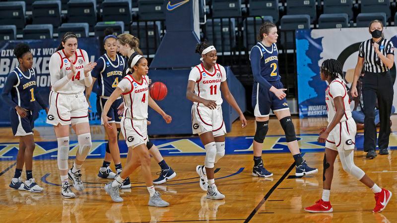 Georgia players reach out to teammate Que Morrison (23) after a basket during the first half against Drexel in the first round of the women's NCAA Tournament Monday, March 22,2021, at the Greehey Arena in San Antonio, Texas. (Ronald Cortes/AP)