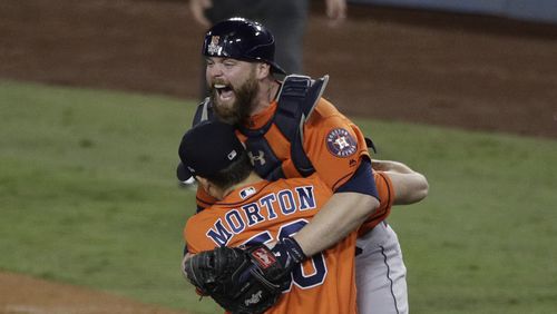 Houston Astros catcher Brian McCann and pitcher Charlie Morton celebrate after win against the Los Angeles Dodgers in Game 7 of baseball's World Series Wednesday, Nov. 1, 2017, in Los Angeles. The Astros won 5-1 to win the series 4-3. (AP Photo/Jae C. Hong)