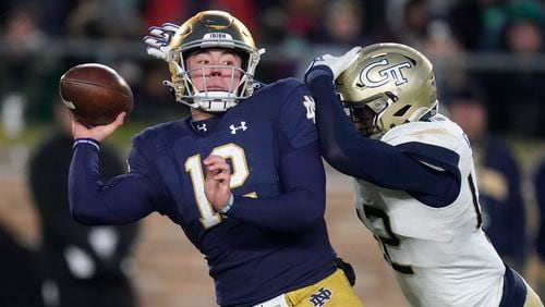 Georgia Tech's Jordan Domineck closes in on Notre Dame's Tyler Buchner last season. Domineck has committed to Arkansas after going in the transfer portal in February. (AP Photo/Darron Cummings)
