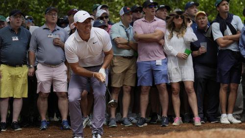 Rory McIlroy, of Northern Ireland, watches his shot from the pine straw on the second hole during the first round at the Masters golf tournament at Augusta National Golf Club Thursday, April 11, 2024, in Augusta, Ga. (AP Photo/Ashley Landis)