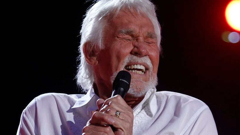 FILE - In this June 9, 2012, file photo, Kenny Rogers performs at the 2012 CMA Music Festival in Nashville, Tenn. Actor-singer Kenny Rogers, the smooth, Grammy-winning balladeer who spanned jazz, folk, country and pop with such hits as âLucille,â âLadyâ and âIslands in the Streamâ and embraced his persona as âThe Gamblerâ on record and on TV died Friday night, March 20, 2020. He was 81. (Photo by Wade Payne/Invision/AP, File)