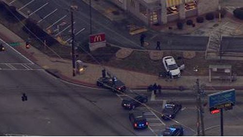 The victim was found dead in his car outside the fast-food restaurant at the intersection of Candler and McAfee roads, according to DeKalb County police
