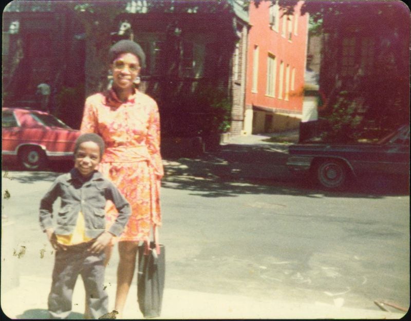 Thelma Suggs and her youngest son, Eric Suggs, in front of their Brooklyn apartment around 1974. (Courtesy of Ernie Suggs)