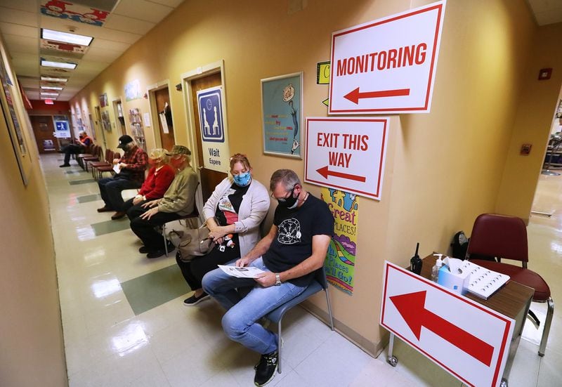 People who've just received a vaccination shot against COVID-19 wait out their 15-minute observation period on Tuesday at the Paulding County Health Department in Dallas, Georgia. (PHOTO by Curtis Compton / Curtis.Compton@ajc.com)