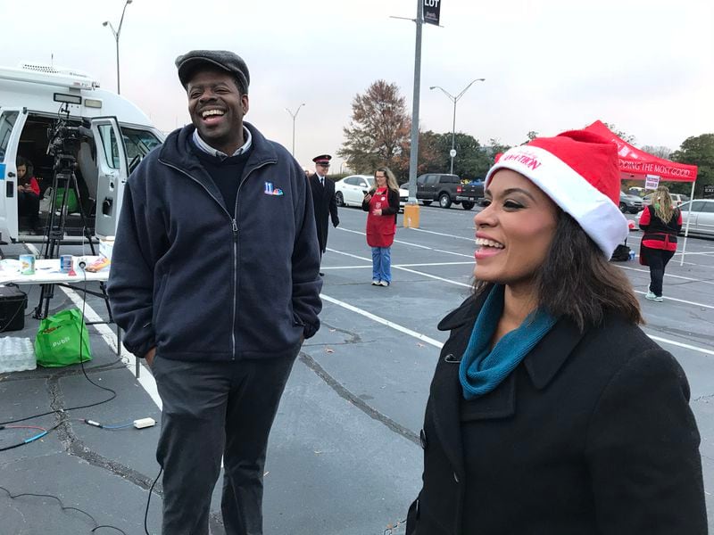  Chesley McNeil and Shiba Russell having some laughs at the Ga. State Stadium lot for the 11Alive Canathon. CREDIT: Rodney Ho/rho@ajc.com